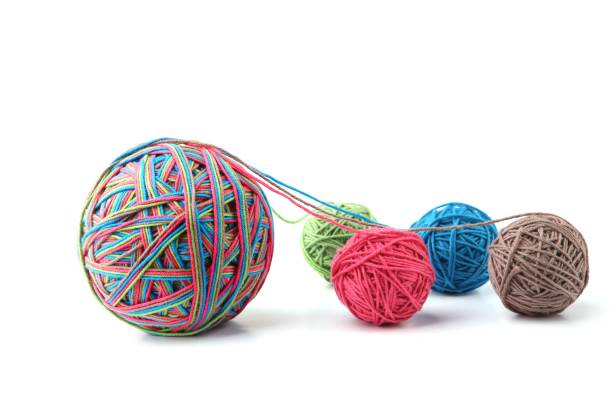 istock Colorful cotton big thread ball from four color thread isolated on white background. 1068031482