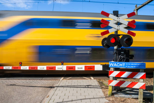 istock Netherlands public transport train crossing 1068036750
