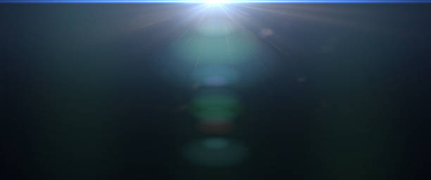 istock blue center and mainly off screen lens flare overlay texture with bokeh effect with black background, cinematic format 1068037078