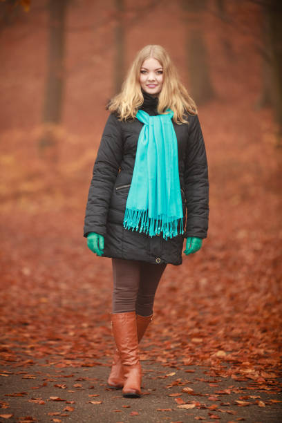 istock Attractive woman in autumnal park. 1068042012