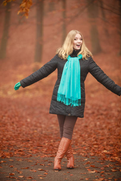 istock Girl is walking through the park. 1068043852