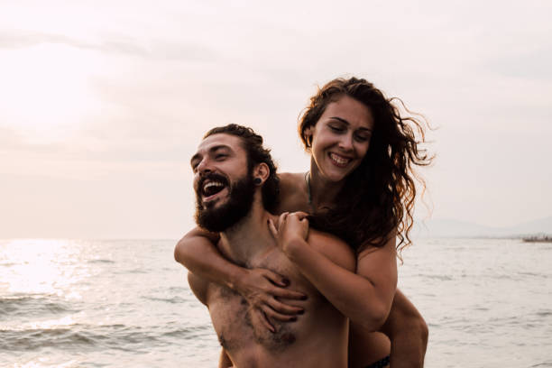 istock Woman hugging boyfriend from behind 1068044584