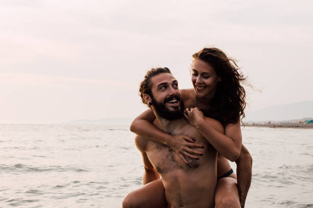 istock Happy couple at the beach 1068044638