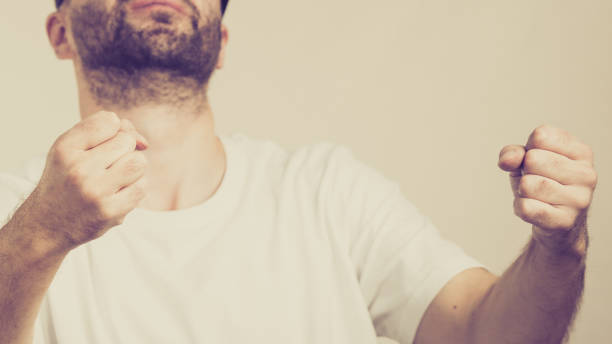 istock Unrecognizable man clenching fists 1068045486