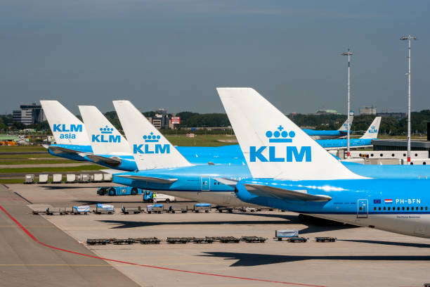 Royal Dutch Airlines KLM airliner at Schiphol Amsterdam Airport AMSTERDAM, THE NETHERLANDS - JUN 27, 2011: KLM airlines passenger planes at the gates of Amsterdam Schiphol Airport. klm stock pictures, royalty-free photos & images