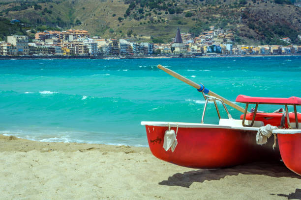 Famous  Giardini Naxos beach on Sicily with turquoise sea in the background