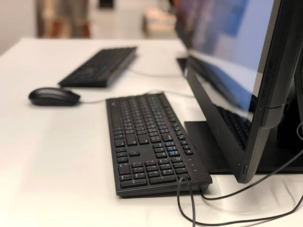 istock Close-Up Of Computer Keyboard And Mouse On Table 1068057540