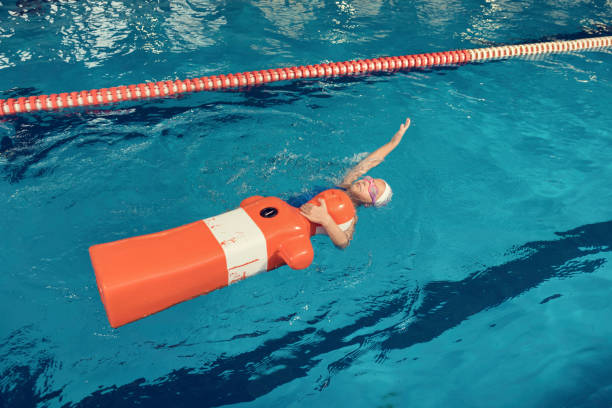 istock Training Dummy and a Girl in a Pool 1068064206