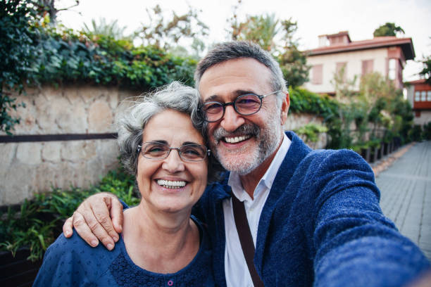 Tourist senior couple taking a selfie