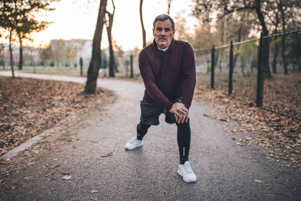 istock Senior man works stretching for jogging 1068071544