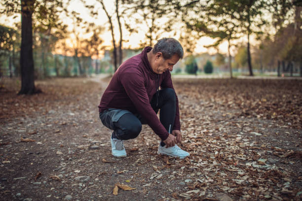 istock Senior man is repairing jogging equipment 1068071546