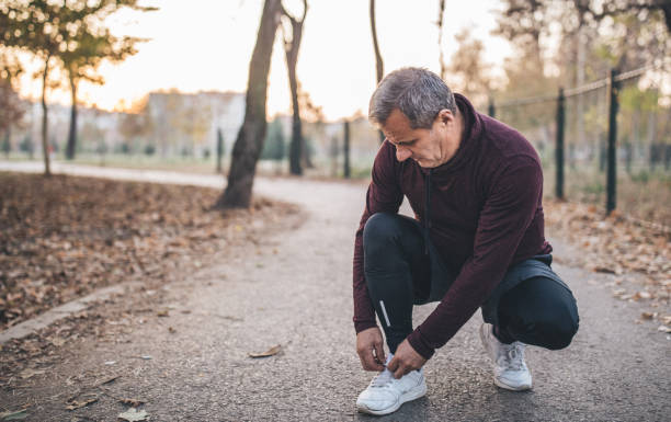istock Senior man is repairing running gear 1068071638