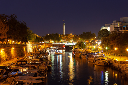 Paris, France - October 10, 2018: View from of Bassin de l'Arsenal to Place de la Bastille at night.