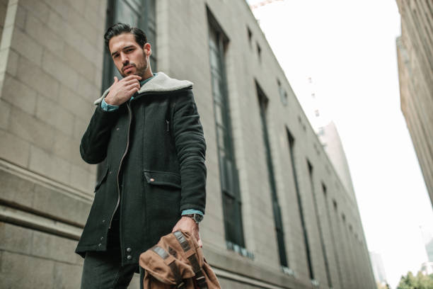 istock Young man walking on the street 1068101572