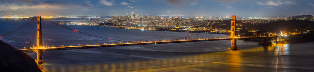 vista nocturna del puente golden gate - gold gate bridge san francisco county fotografías e imágenes de stock