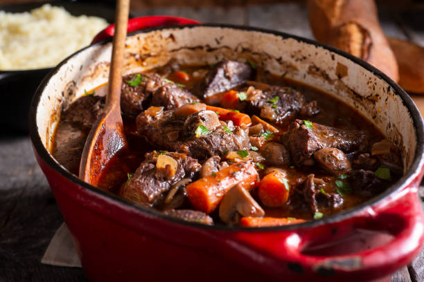 boeuf bourguignon - carrot close up silverware cutting board fotografías e imágenes de stock