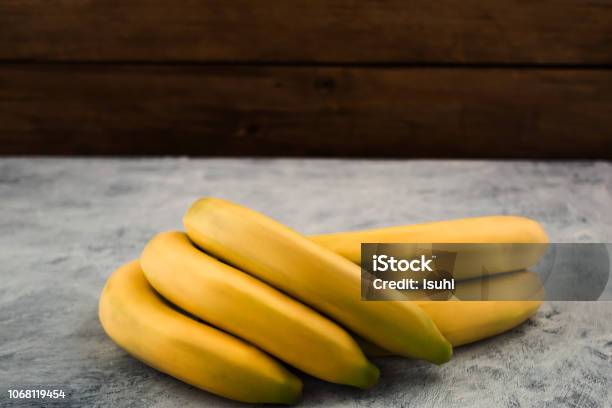 Tropical Ripe Bananas On Wooden Background Copy Space Stock Photo - Download Image Now