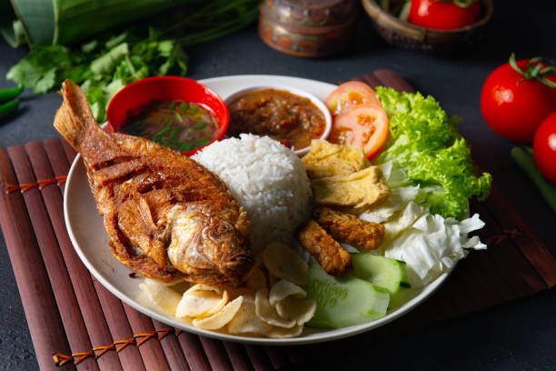 istock traditional malay indonesian tilapia fish rice 1068123134