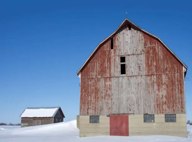 An old and weathered red wood barn on crisp and clear Ontario winter day. Similar Images: