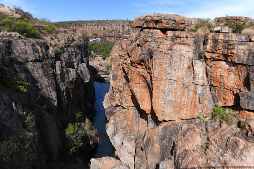 Upper part of Blyde River Canyon at Bourke's Luck. Red sandstone walls form this 25 kilometers (16 mi) long and 750 meters (2460 ft) deep natural feature located in the Mpumalanga Province, South Africa. It is the second largest canyon in Africa, after the Fish River Canyon.
