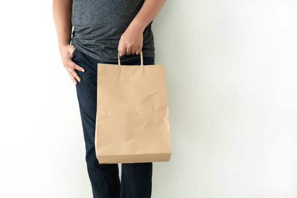 istock Consumer pack product Man shows bag mock up show 1068143842