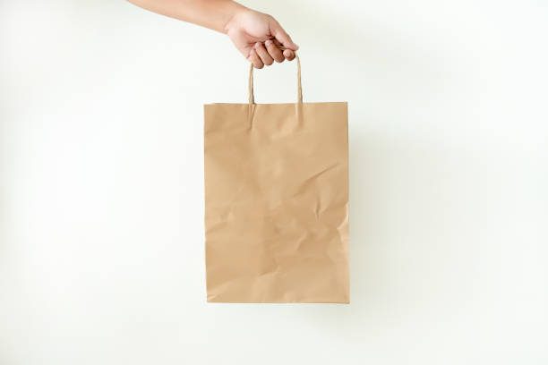 istock Consumer pack product Man shows bag mock up show 1068143910
