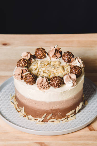 istock female chef dressed in uniform preparing a cake 1068148796