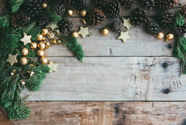 istock Christmas background with decorations and gift boxes on the wooden table. 1068163972