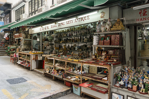 Hong Kong, China - May 24 2018: Antiques, memorabilia and other knick knacks stall in the historic Cat Street market in Soho, Hollywood road in Hong Kong island Sheung Wan district