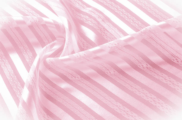 istock Background texture, pattern. Pink silk fabric with a light stripe. A smooth elegant pink silk or satin texture can be used as a background. Trend of color rose quartz pink pastel tone 1068184680