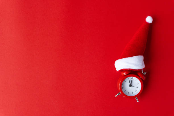 istock Creative flat lay vintage clock on red office table top view background concept alarm clock on red paper color with copy space in minimal style, empty template for text, break workplace at noon for lunch, back to school. 1068191714