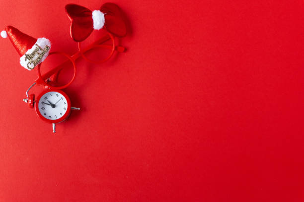 istock Creative flat lay vintage clock on red office table top view background concept alarm clock on red paper color with copy space in minimal style, empty template for text, break workplace at noon for lunch, back to school. 1068191716