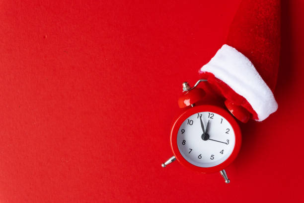 istock Creative flat lay vintage clock on red office table top view background concept alarm clock on red paper color with copy space in minimal style, empty template for text, break workplace at noon for lunch, back to school. 1068191724