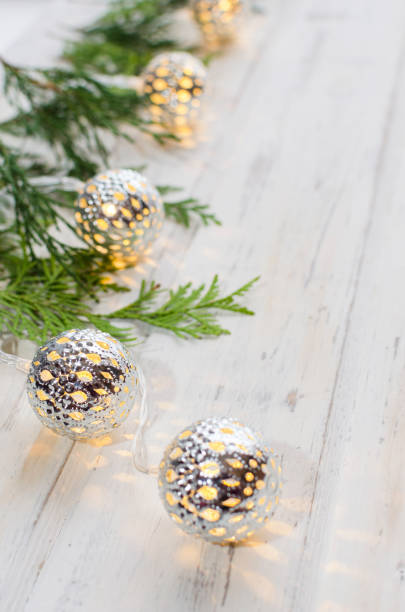 istock Christmas composition. Fir and thuya tree branches on white wooden background. 1068192640