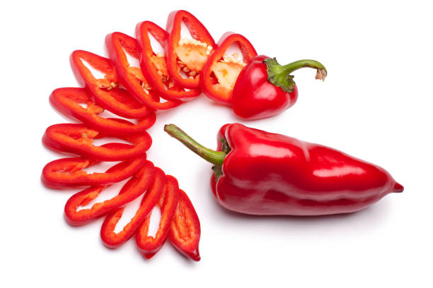 istock Red pepper whole and red pepper sliced with rings on a white background isolated top view 1068200008