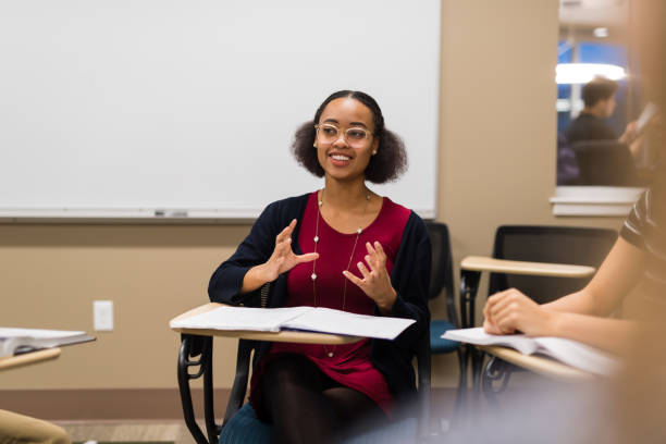 istock Students at their desks in a university classroom 1068204476