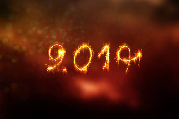 istock New Year 2019 text handmade written sparklers fireworks. 1068209876