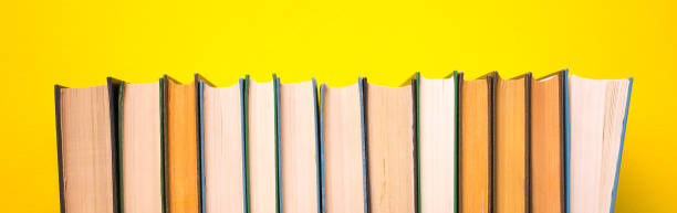 istock Books on a yellow background 1068210594