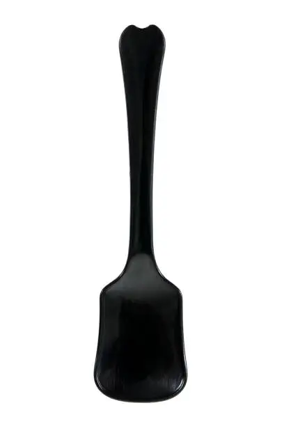 Vertical ice cream spoon isolated on white background. Black plastic ice cream isolated