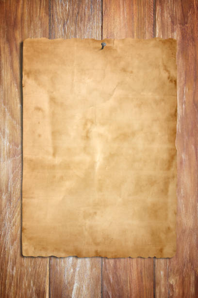 istock Old paper on the wood background 1068228268