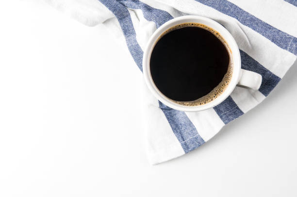 istock Cup of coffee on a towel with a blue stripe 1068231000
