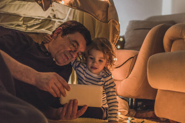 istock Enjoying in a tent with my grandfather 1068233724