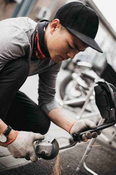 istock Garage mechanic working on motorcycle in China 1068234304