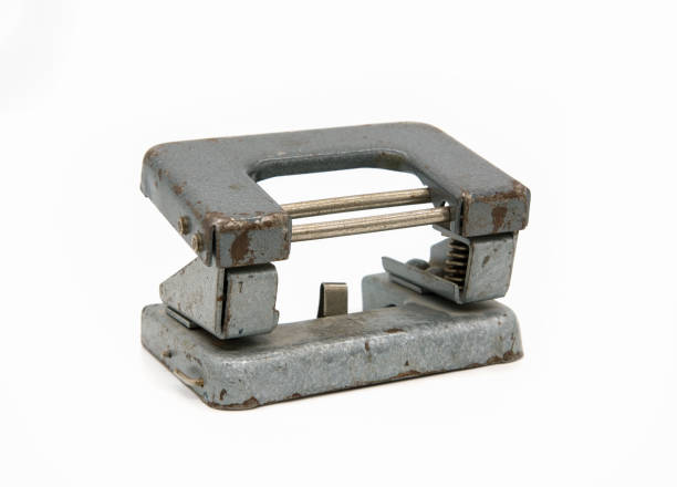 istock old vintage hole punch on white isolated background 1068238140