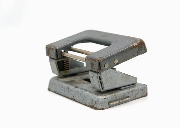 istock old vintage hole punch on white isolated background 1068238146