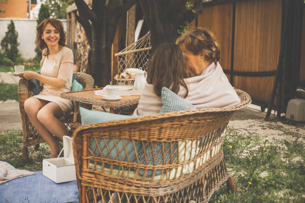 istock Three generations of women having tea party 1068248582