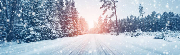istock winter road, covered with snow on sunny day 1068256514