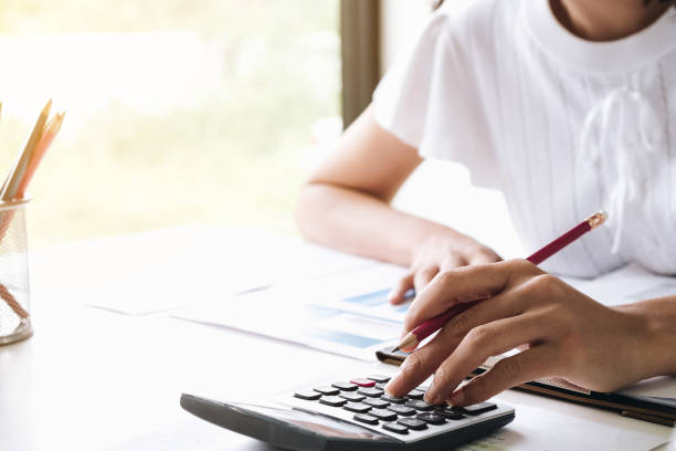 istock Closeup of Accountant Hands Counting on Calculator 1068265734