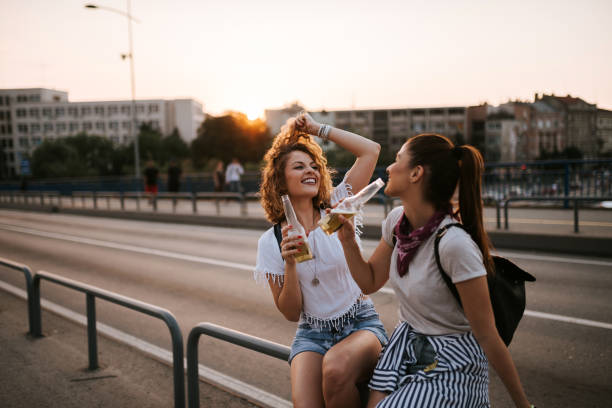 istock Friends laughing and having fun outdoors. Summer holiday concept. 1068271340