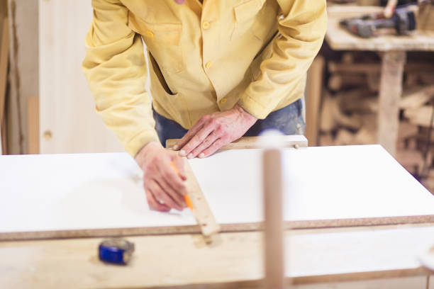 istock Man working in carpentry workshop, close-up details 1068271842